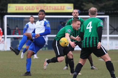 Enfields James Mulley (L) is penalised for backing into Pat Harding