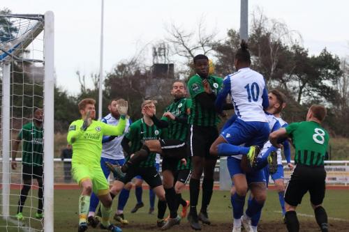 Enfields Karl Oliyide (10) heads across goal for Billy Bricknell (white, L) to make the score 2-1