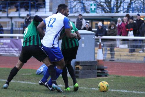 Enfields Kezie Ibe (12) tries to hold the ball in the corner in the closing minutes