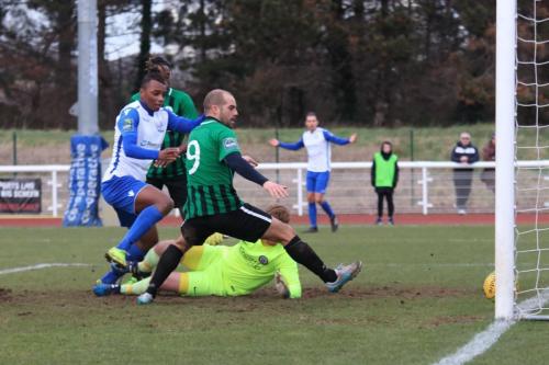 Karl Oliyide (L) scores the first Enfield goal