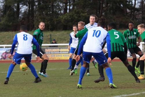 New Enfield signing James Mulley (8) tries to turn for a shot on goal