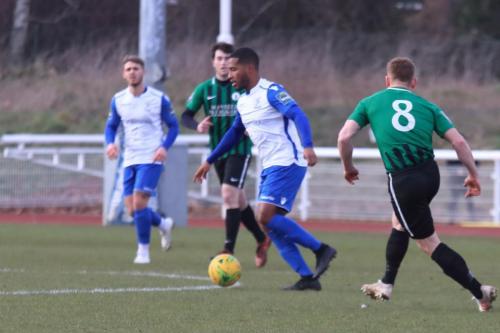 New Enfield signing James Mulley closed down by Pat Harding (R)