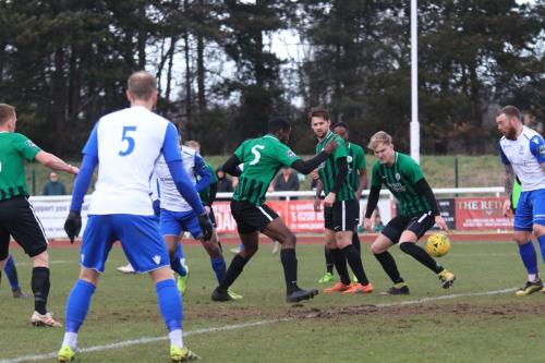 The ball runs to Enfields Billy Bricknell (R) who nets but is given offside