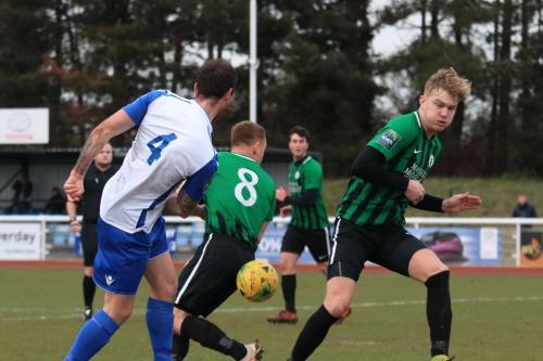 The build up to the first Enfield goal  Matt Johnsons (4) shot is blocked by James Richmond and falls for Sam Hatton (out iof shot)