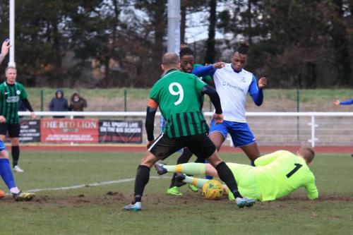 The build up to the first Enfield goal   Billy Bricknells shot is saved by keeper Josh James but Karl Oliyide (white, R) is on hand to tuck home the rebound