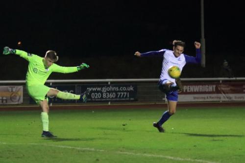Burgess Hill keeper Mitchell Bromage clears past Sam Youngs attempted block