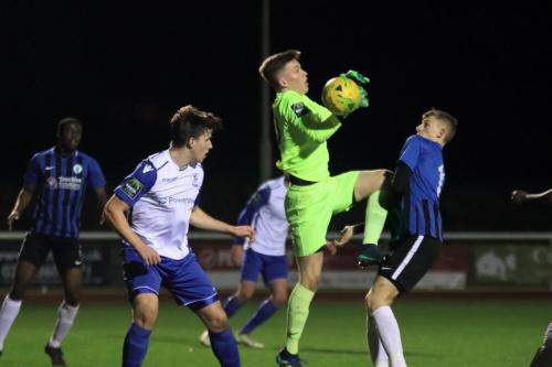 Burgess Hill keeper Mitchell Bromage fumbles a cross