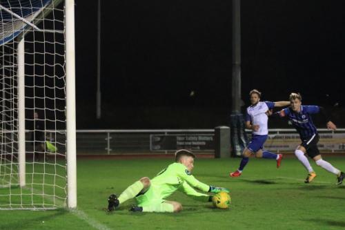 Burgess Hill keeper Mitchell Bromage saves at his near post