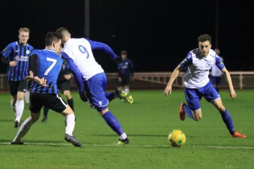 Enfields Billy Bricknell (9) backheels the ball past Charlie Bennett to set up Bilal Sayoud