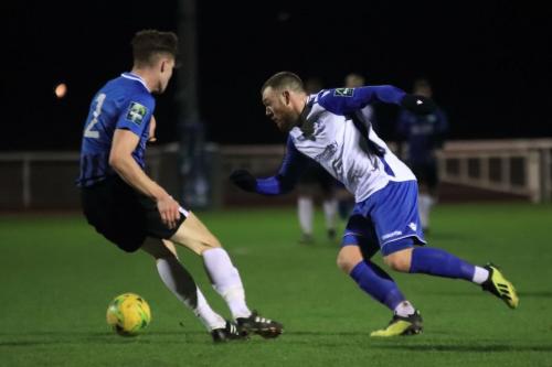 Enfields Billy Bricknell (R) runs at Josh Tuck