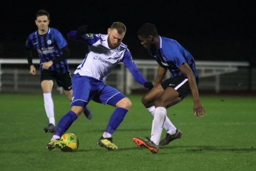 Enfields Billy Bricknell and Burgess Hills Tolulope Jonah (L) and Charlie Bennett