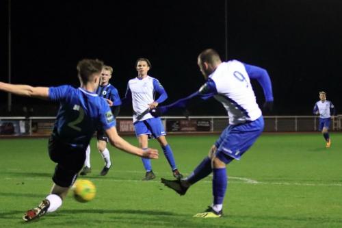 Enfields Billy Bricknell shoots as Josh Tuck (2) tries to block