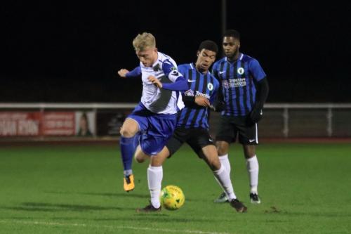 Enfields Ryan Blackman (L) and Burgess Hills Marco Figuero Correia and Andre McCollin (R)