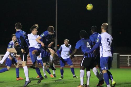 Enfields Sam Youngs (white, 2nd L) heads over the bar