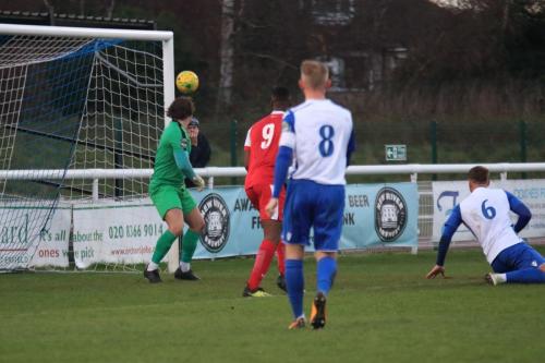 Enfield keeper Joe Wright can only watch as Tom Hitchcock (not in picture) scores Harlows equaliser