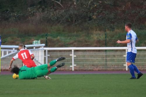 Enfield keeper Joe Wright knocks the ball away from Christian Scales aftyer an error by Marc Weatherstone (R)