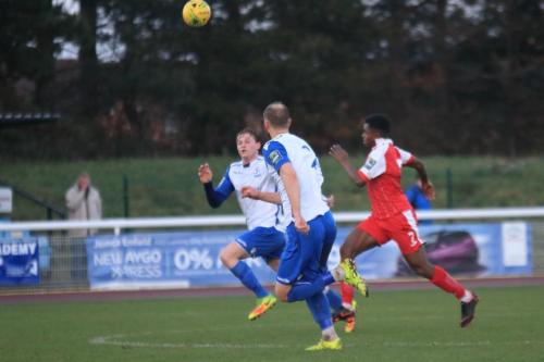 Enfields Aaron Greene (L) and Sam Hatton close down Mayowa Adajes breakaway