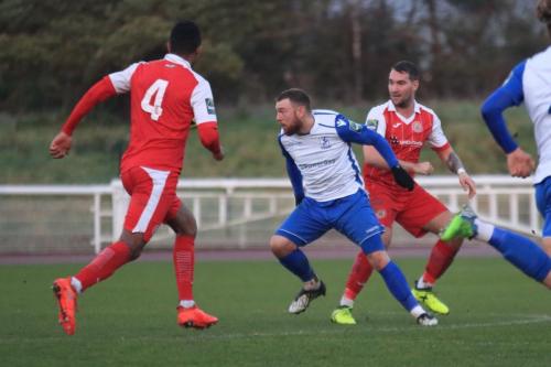 Enfields Billy Bricknell and Harlows former Enfield defenders JJ da Cruz (L) and Taylor Hastings
