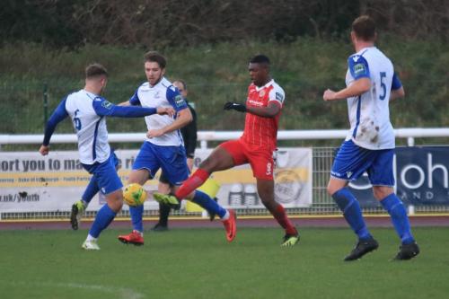 Enfields Dan Rumens (6) challenges Emile Acquah