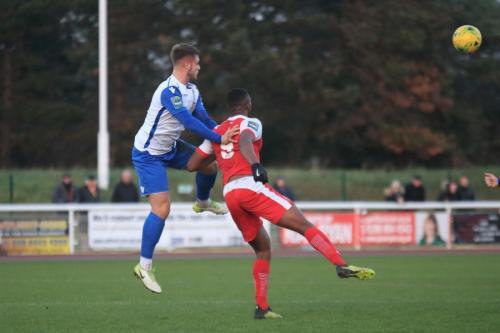 Enfields Dan Rumens (L) wins a challenge against Emile Acquah