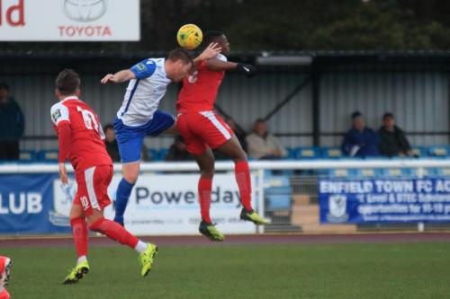 Enfields Marc Weatherstone challenges Emile Acquah (R)