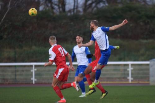 Enfields Sam Hatton (R) wins a header