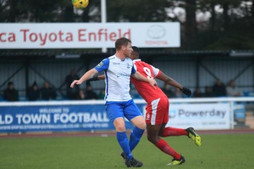 Harlows Emile Acquah (r) knocks the ball past Marc Weatherstone