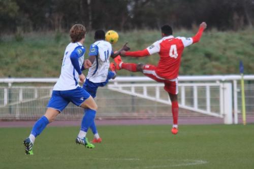 Harlows JJ Da Cruz (red) challenges Muhammadu Faal