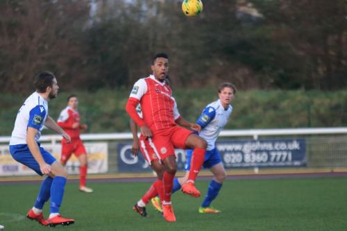 Harlows JJ da Cruz (red) beats Remi Sutton to a header