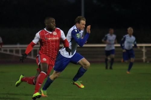 Harlows Nathan Koranteng (L) and Enfields Aaron Greene