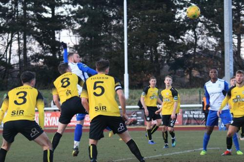 Billy Bricknell (white, L)) heads the opening goal