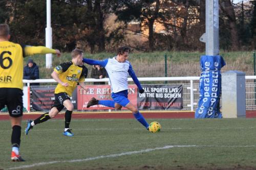 Enfields Sam Youngs crosses from the left