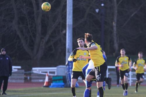 Margates Liam Friend (5) wins a header