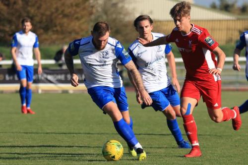 Enfields Billy Bricknell (L) and Sam Youngs and Whitehawks Fintan Walsh