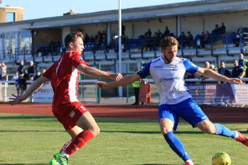 Enfields Remi Sutton crosses as Luke Emberson tries to block