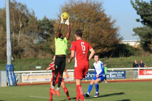 Whitehawk keeper Melvin Minter collects a cross
