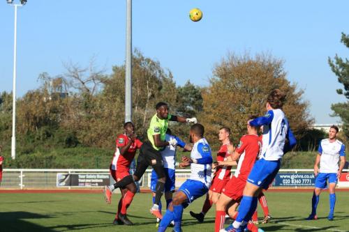 Whitehawk keeper Melvin Minter punches clear