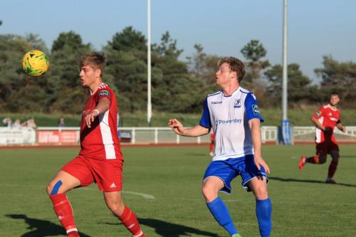 Whitehawks Fintan Walsh (L) clears from Aaron Greene