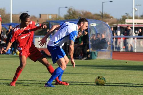 Whitehawks Ky Marsh-Brown (L) challenges Matt Johnson