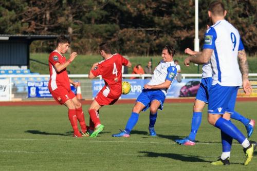 Whitehawks Luke Emberson (4) blocks a shot from Sam Youngs
