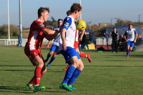 Whitehawks Luke Emberson (L) and Enfields Aaron Greene