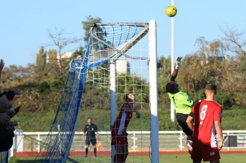 Whitehawks Melvin Minter tips a header over the bar