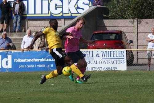Enfields Aaron Greene (pink) crosses past Jerald Aboagyes attempted block