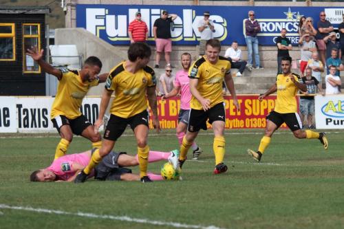 Enfields Liam Hope (pink) is crowded out by the defence