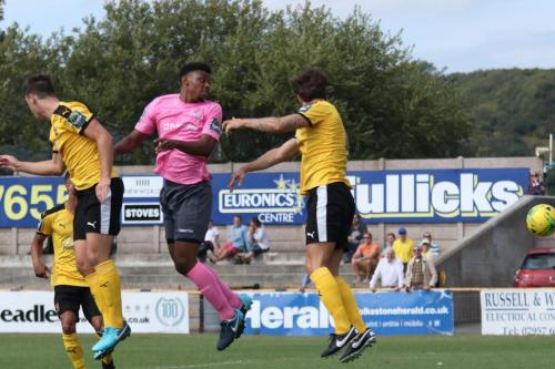 Enfields Rian McLean (pink) cant quite make contact with a crossx