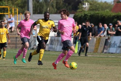 Enfields Sam Chaney (R) and Aaron Greene and Folkestones Jerald Aboagye