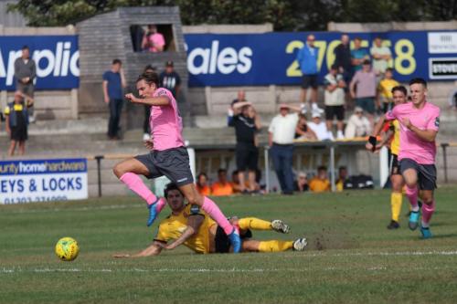 Enfields Sam Youngs beats Matt Newman before shooting against the bar  The rebound fell to Brandon Adams (R) for the winning goal