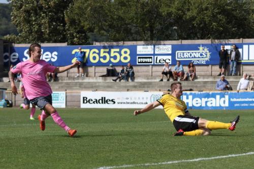 Folkestones Callum Davies (R) cuts out a cross beofre it can reach Sam Chaney