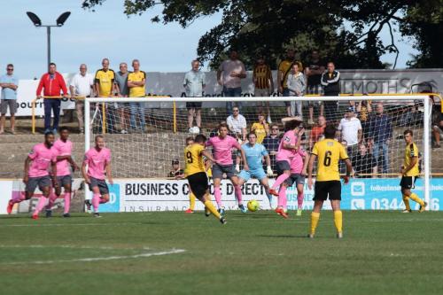 Folkestones Ian Draycott (9) follows up after the initial shot from the free kick is blocked but the Enfield defence holds firm