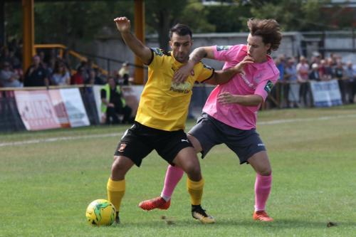 Folkestones Kieron McCann (L) and Enfields Sam Chaney